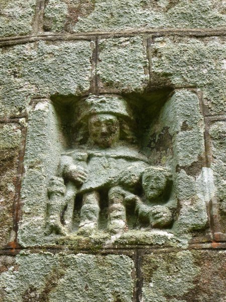 The carving of Saint Roch on the exterior of the chapel of Notre-Dame de la Fosse, Locuon
