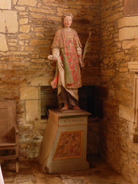 A life size painted sculpture of Saint Etienne in the church of Saint-Gobrien, Brittany